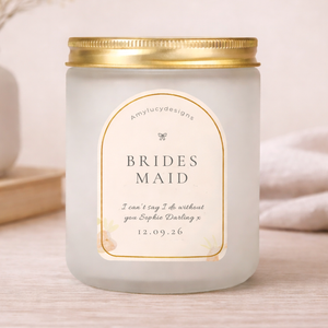 Candle with a personalized label on a light background