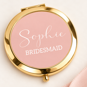 Close-up of gold bridesmaid compact mirror with Sophie personalisation