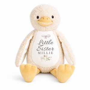 Personalised yellow duck plush with Little Sister and Millie printed on the white chest
