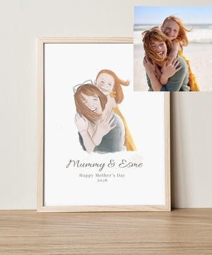 Framed artwork of a mother and child with 'Mummy & Esme' text, next to a photo of a woman and child on a beach.
