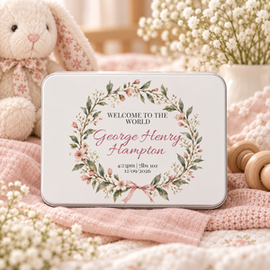Personalised new baby keepsake tin in pink floral design styled with soft Little Lucy nursery props