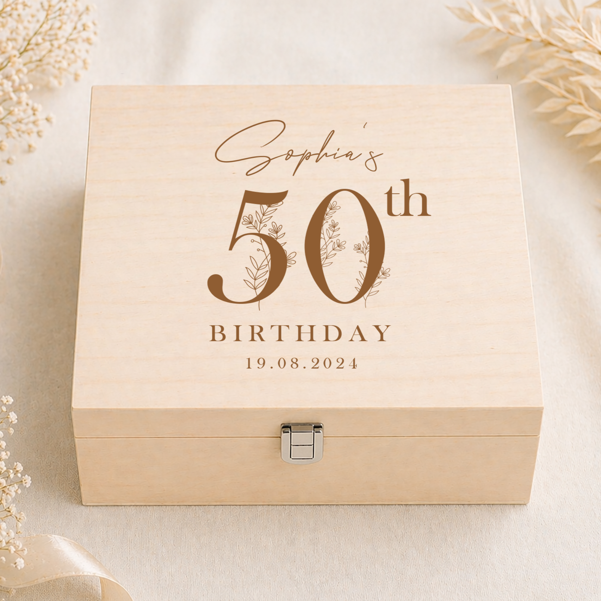 A personalized light wood keepsake box with a metal clasp, engraved with 'Sophia's 50th Birthday 19.08.