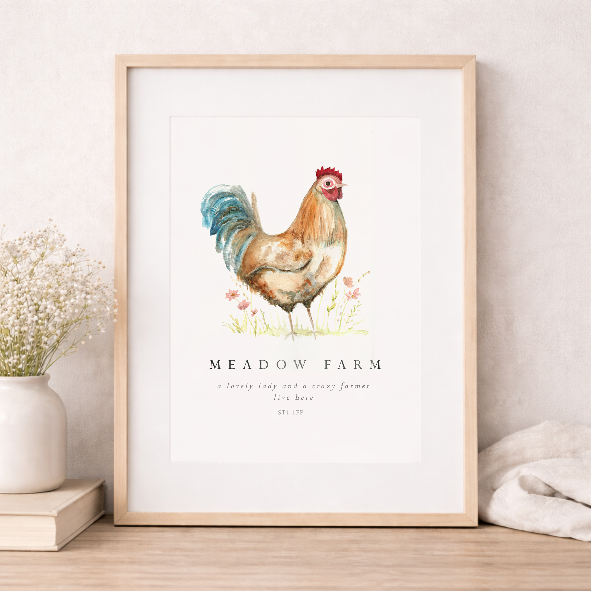 Framed artwork of a rooster with 'Meadow Farm' text on a light background
