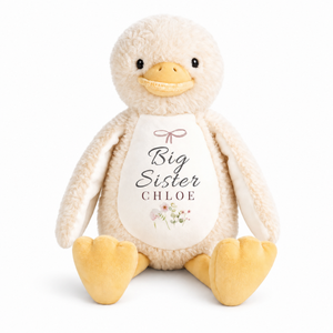 Personalised yellow duck plush with Big Sister and Chloe printed on the white chest