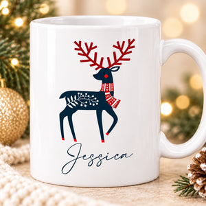 Close-up of navy and red Scandinavian reindeer artwork and Jessica personalisation on Christmas mug