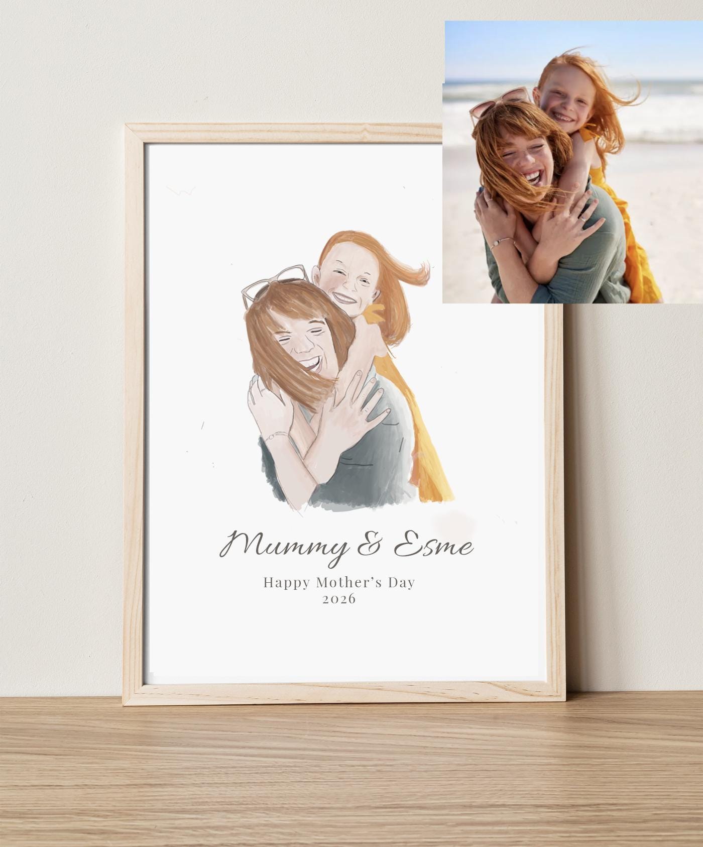 Framed artwork of a mother and child with 'Mummy & Esme' text, next to a photo of a woman and child on a beach.