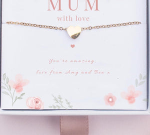 Gold heart bracelet on a card with 'Mum with love' text and floral design