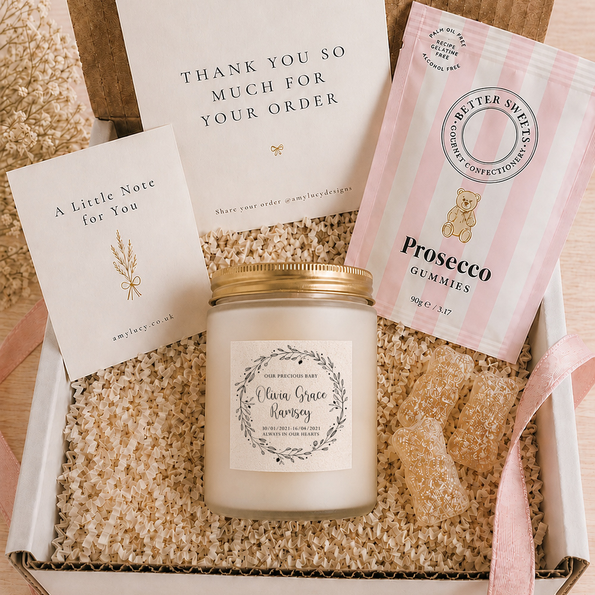 Lit personalised Baby Loss Memorial Candle in a styled setting