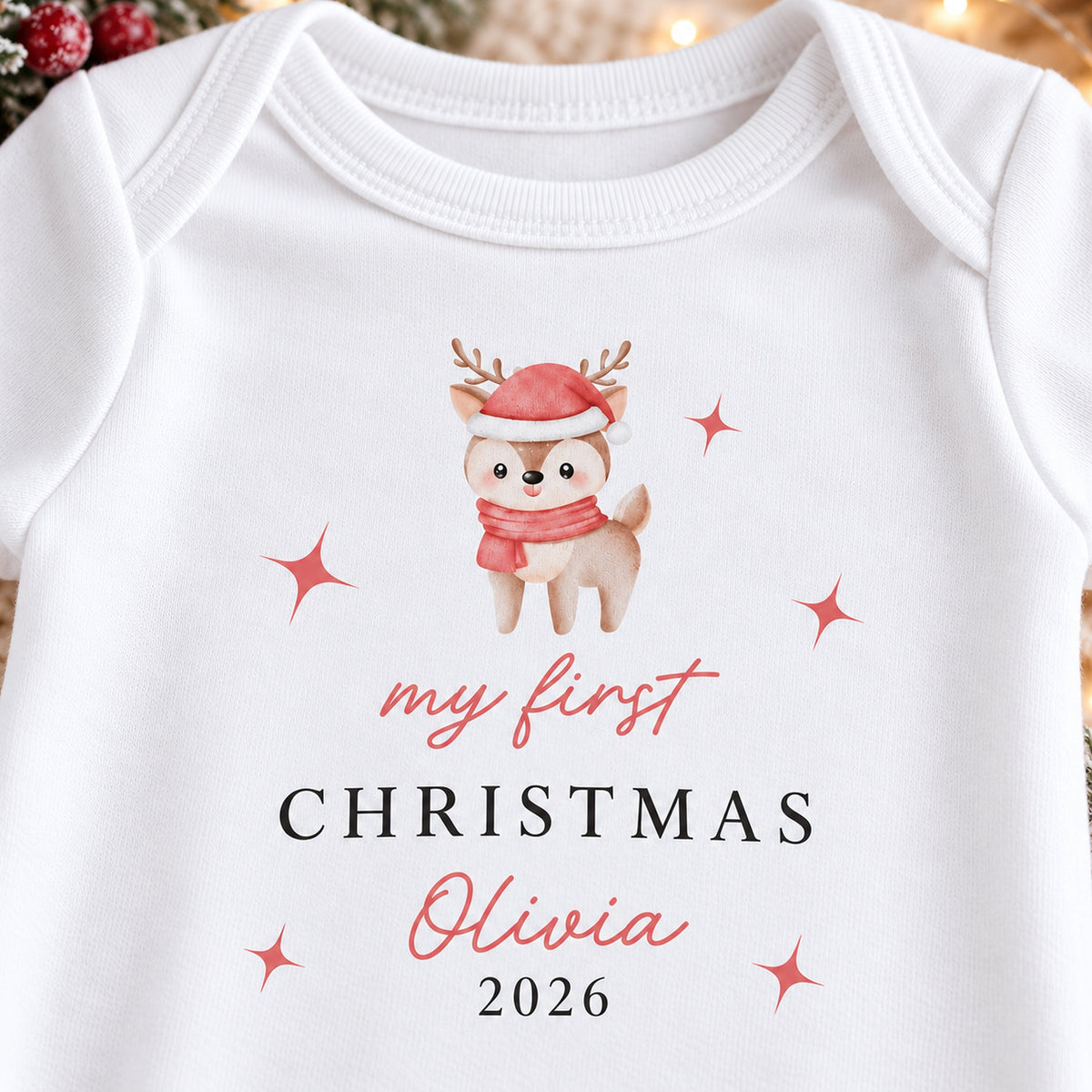 Close-up of personalised festive reindeer First Christmas baby rompersuit design with Olivia 2026