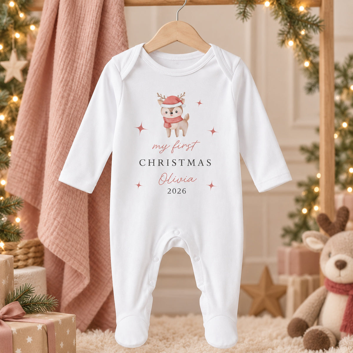 Personalised festive reindeer First Christmas baby rompersuit hanging in a refined Christmas setting