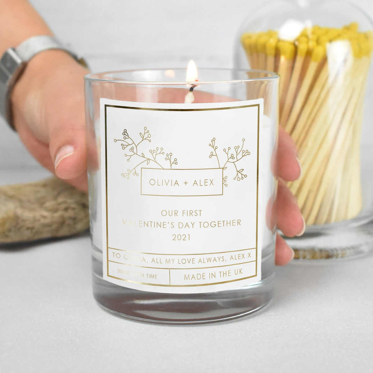 Lit personalised First Valentine’s Day Candle in a styled setting