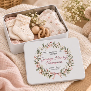 Open personalised new baby keepsake tin with baby socks, wooden rattle and pink floral lid