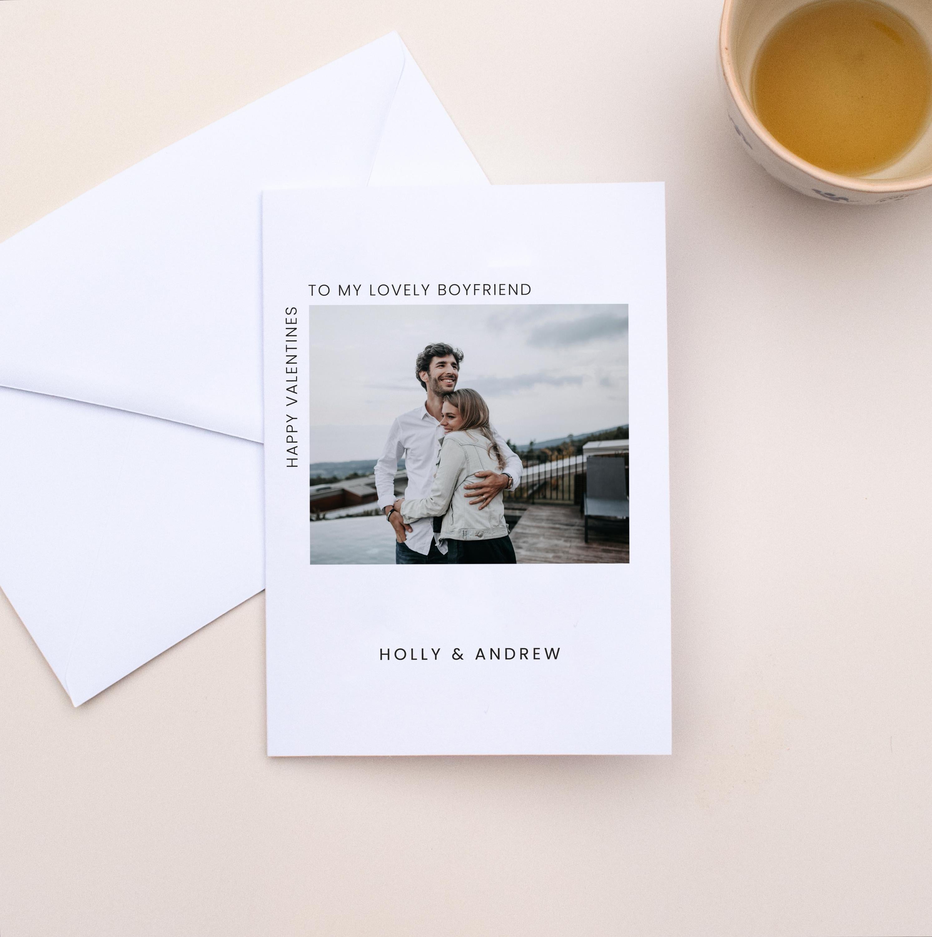 Valentine's Day card with a photo of a couple and personalized text on a beige surface.